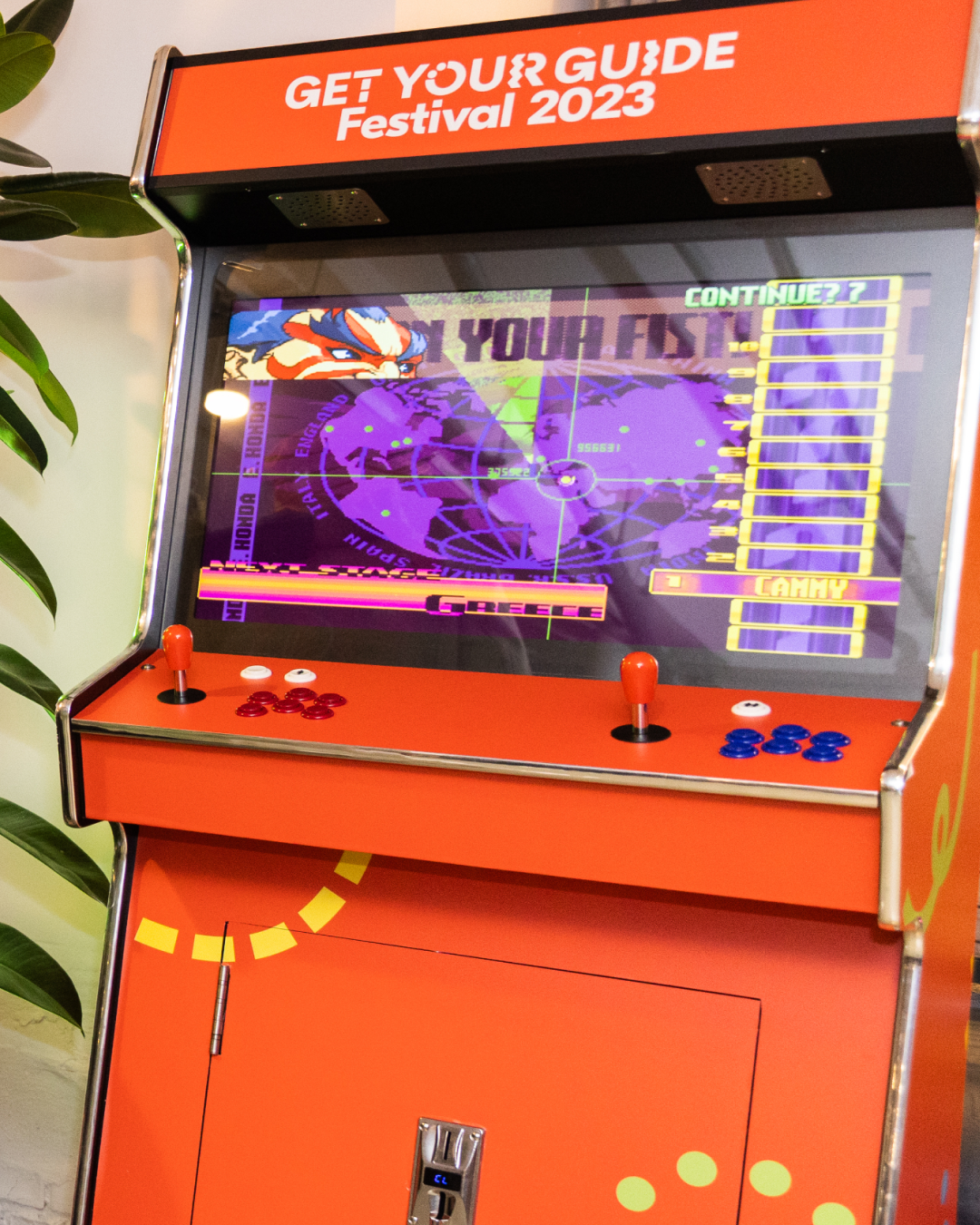 A gaming machine branded in orange and the brand's pattern